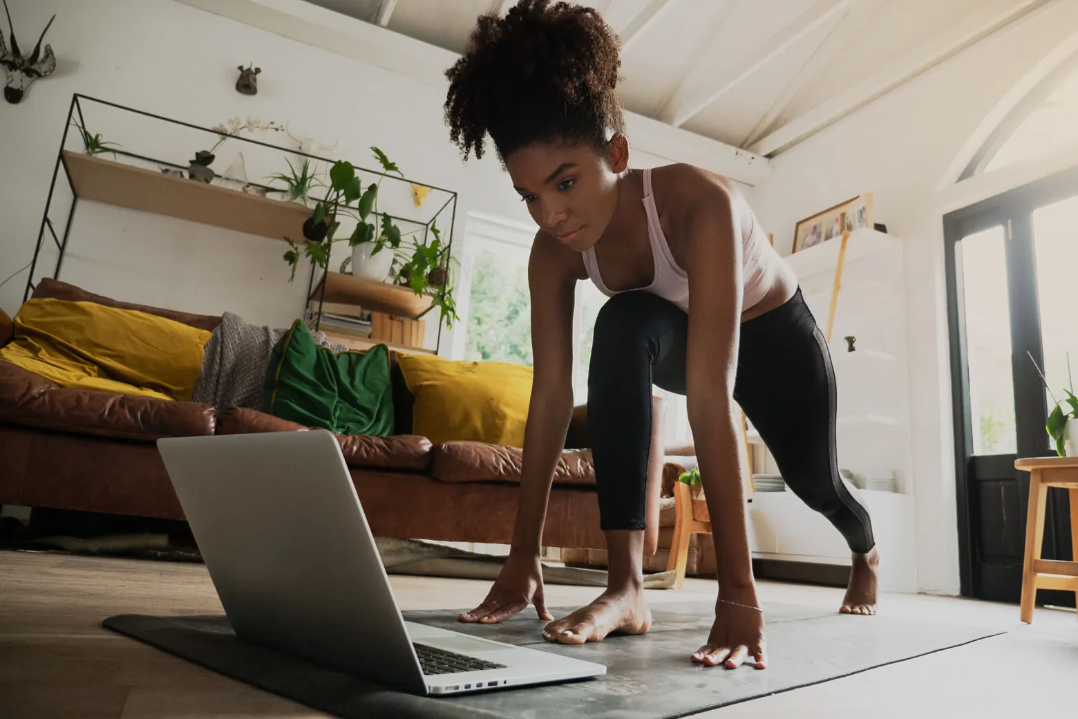 Office worker stretching at a standing desk